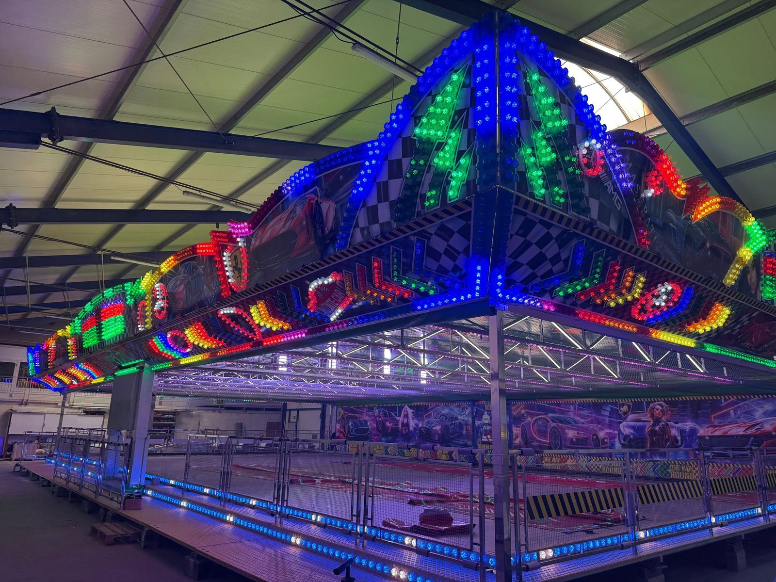 Illuminated Autoscooter canopy with racing artwork